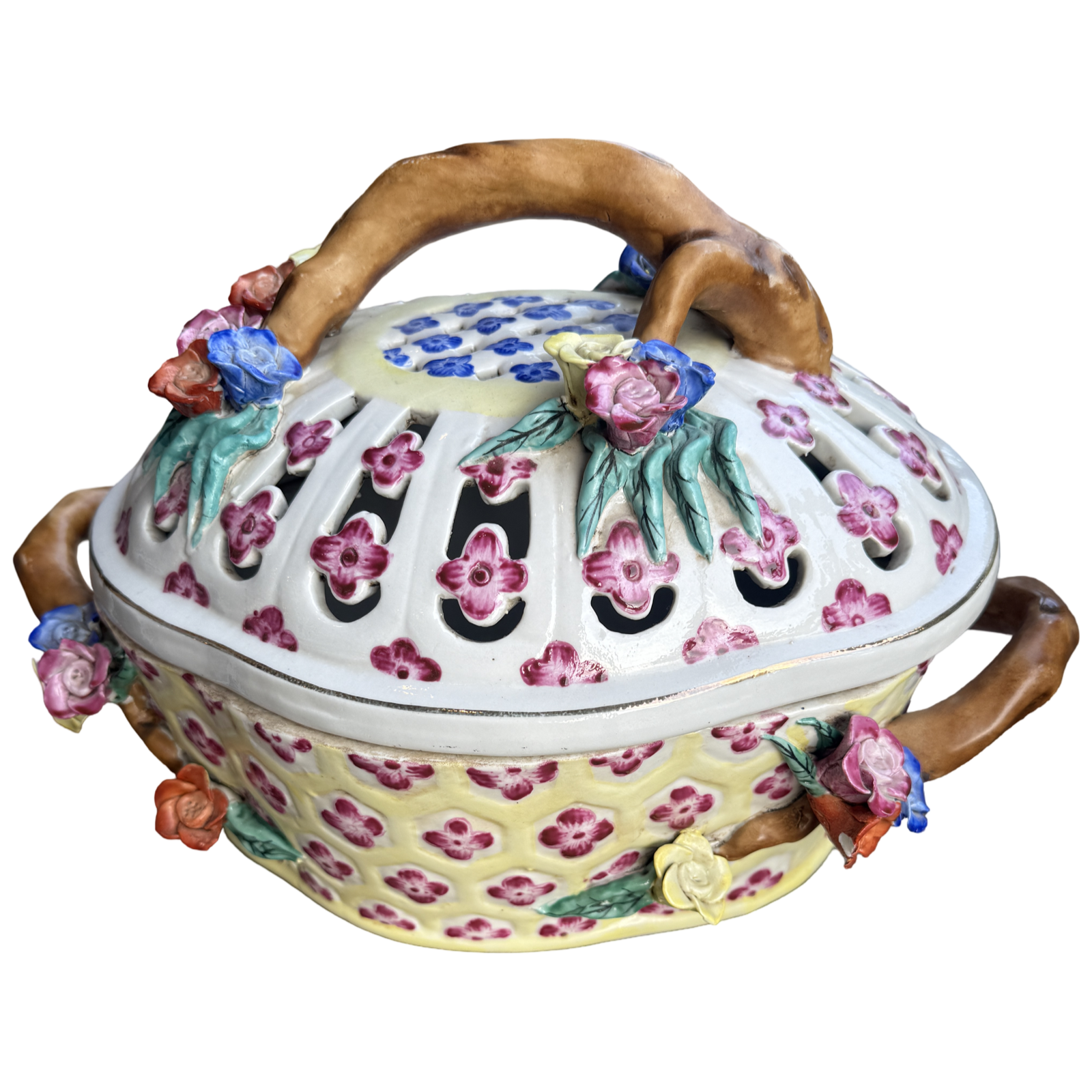 Decorative ceramic pot with floral designs and wooden handles on a white background