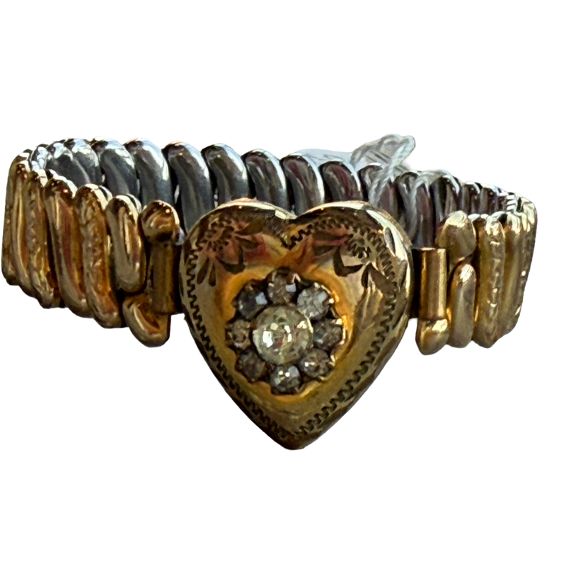 Gold bracelet with a heart-shaped clasp on a white background