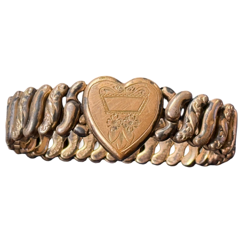 Bronze bracelet with a heart-shaped clasp on a white background