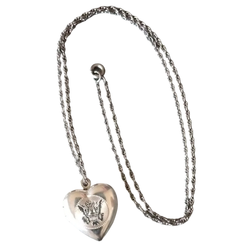 Silver heart-shaped pendant necklace on a white background