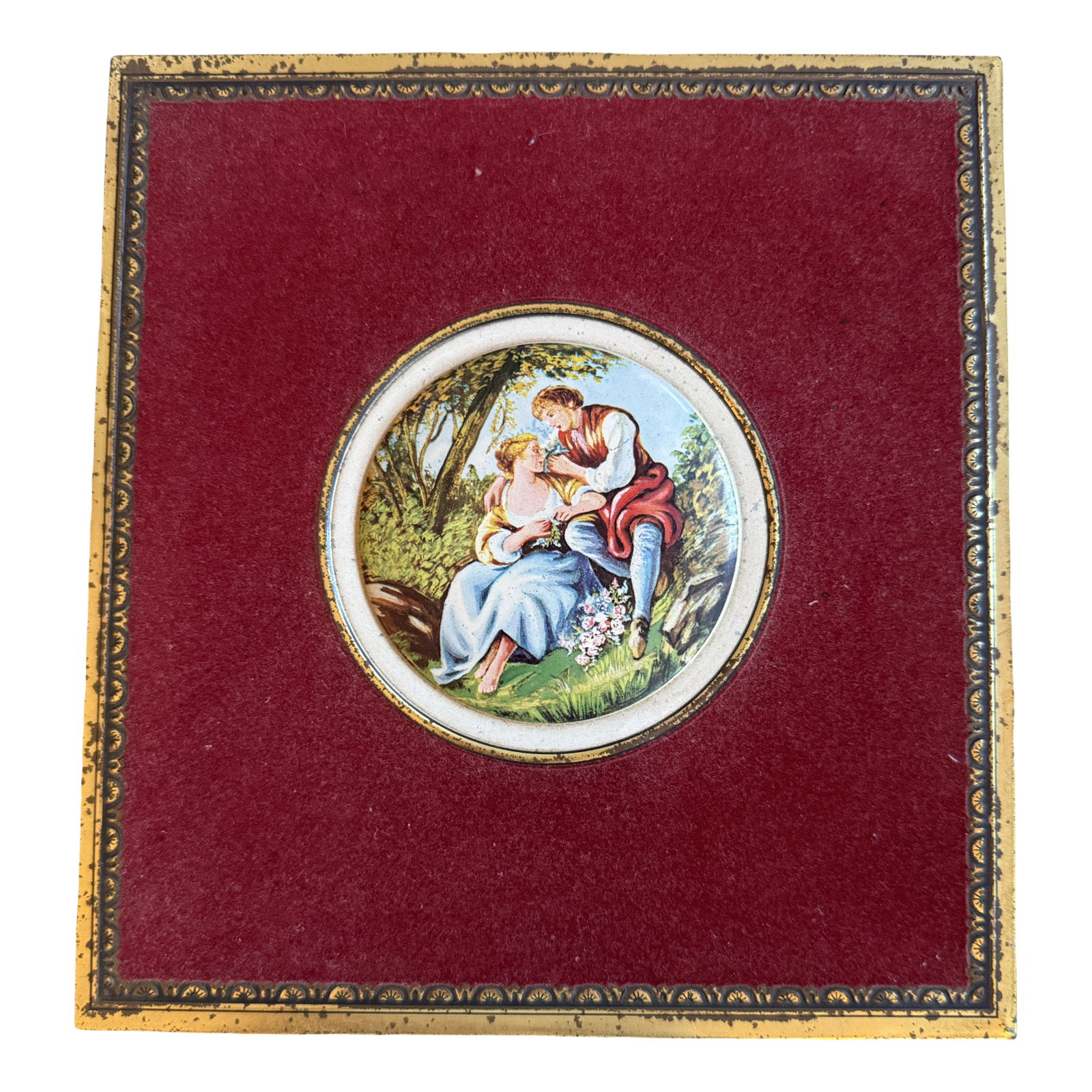 Decorative box with a circular painting of a couple on a red background