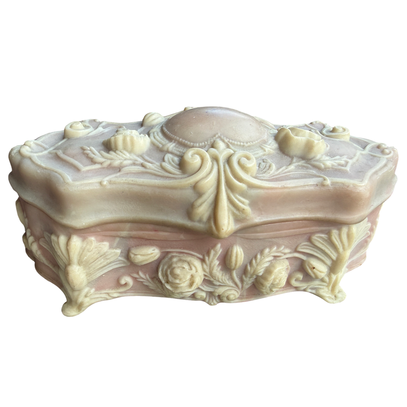 Decorative cream-colored jewelry box with intricate designs on a white background