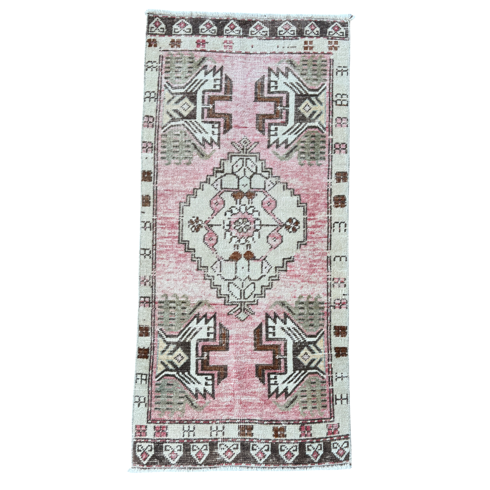 Vintage-style rug with geometric pattern on a white background