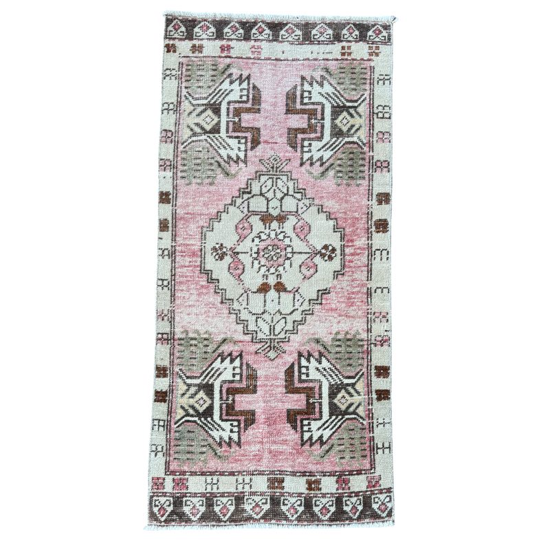 Vintage-style rug with geometric pattern on a white background