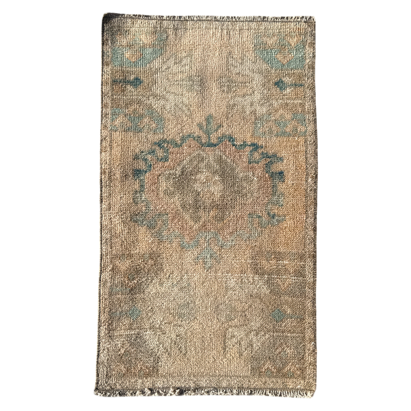 Vintage-style rug with a circular pattern on a plain background