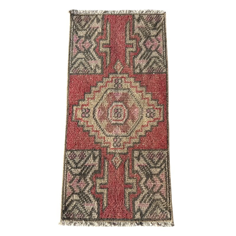 Decorative rug with geometric pattern on a white background