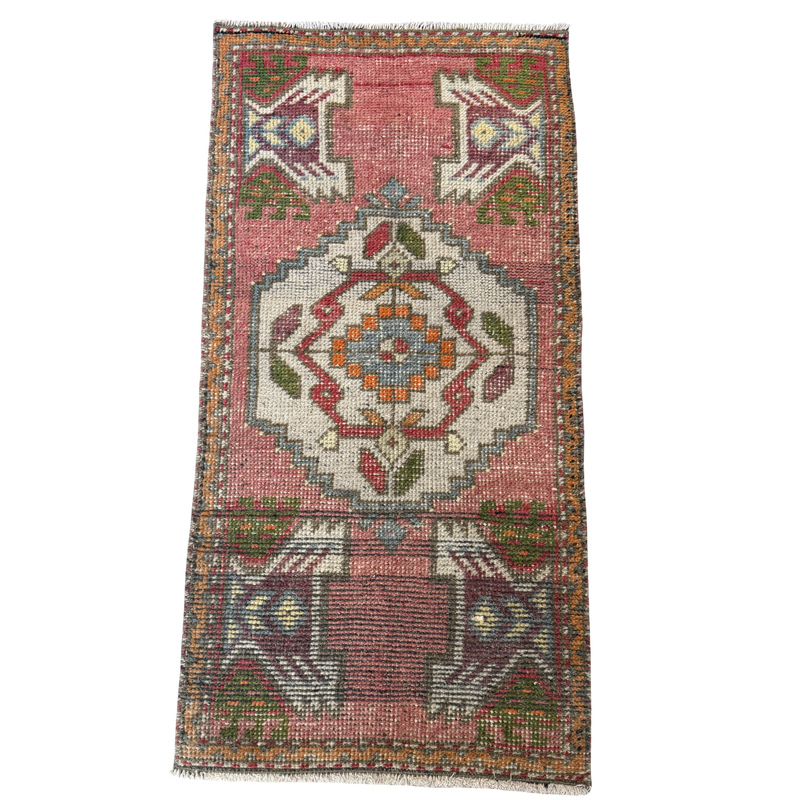 Decorative rug with geometric pattern on a white background