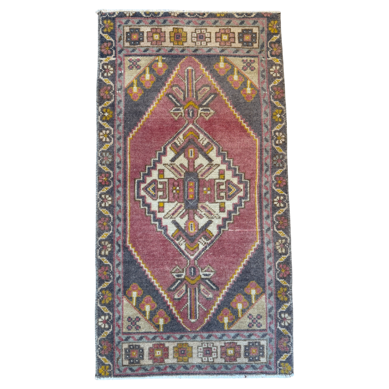 Decorative rug with geometric pattern on a white background