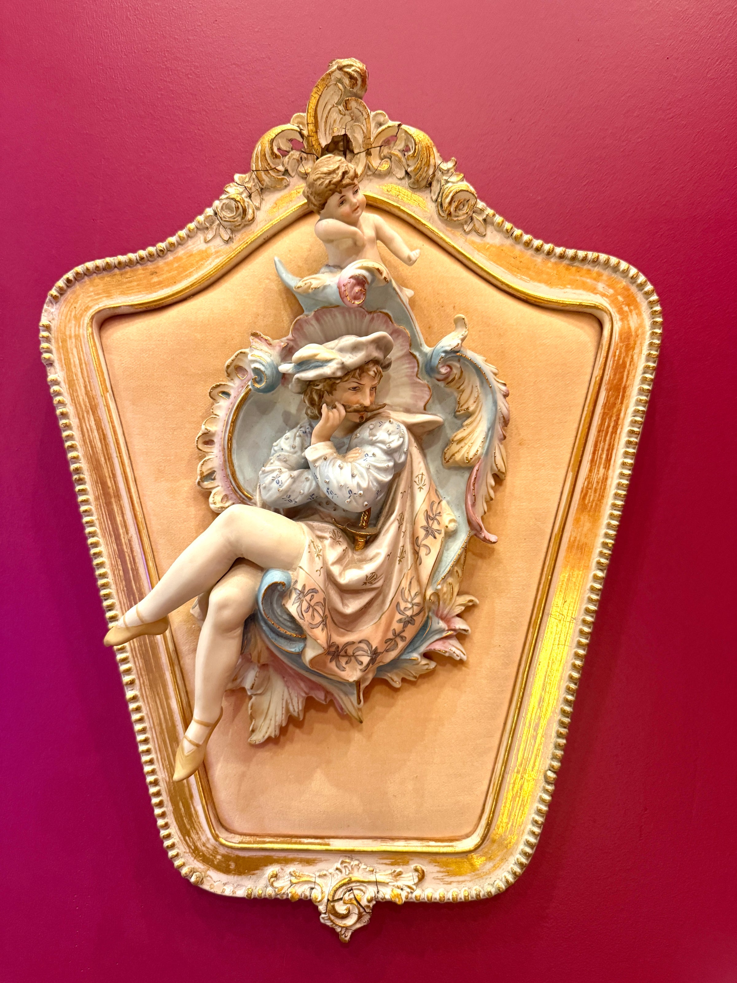 Decorative wall plaque with a woman's silhouette on a red background