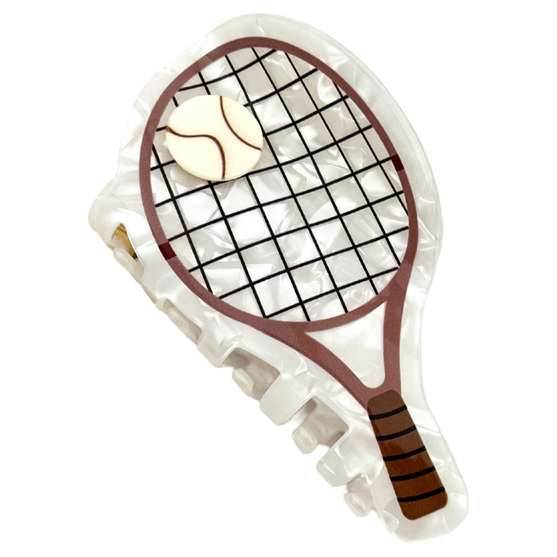 White acetate tennis racket-shaped claw clip designed as a sporty statement hair accessory.
