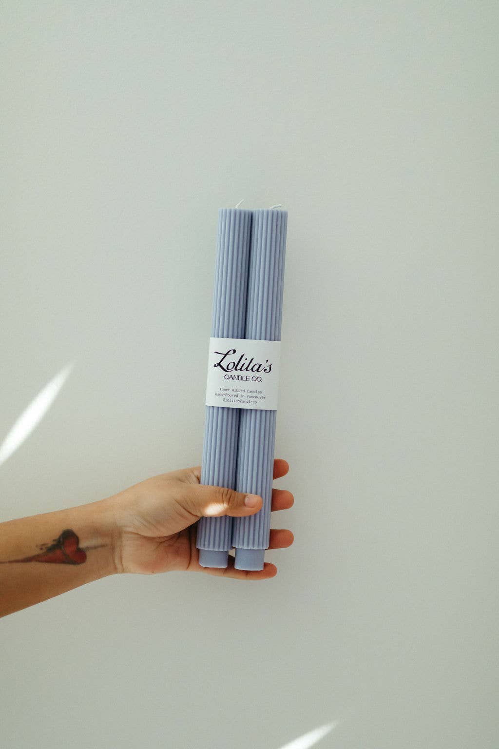 unscented lilac pillar candles, soy beeswax taper candle, eco-friendly taper candles, clean burning decorative candle, sculptural lilac candles, hand poured candle set, pastel purple home decor candles, Rome pillar candle lilac, natural wax dripless candle, non-toxic table candles